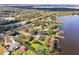 Lakeside property with docks and lush trees in an aerial landscape at 8309 W Lake Marion Rd, Haines City, FL 33844