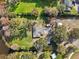 Aerial view of property featuring a house, large yard, and water access at 8309 W Lake Marion Rd, Haines City, FL 33844