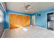 Bedroom with tiled floors, a ceiling fan, and a large closet at 8309 W Lake Marion Rd, Haines City, FL 33844