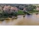 Aerial view of a home with dock extending into a calm lake at 8309 W Lake Marion Rd, Haines City, FL 33844
