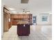 Spacious kitchen boasting a large island, ample cabinetry, and tiled flooring at 8309 W Lake Marion Rd, Haines City, FL 33844