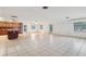 Spacious kitchen featuring large island, tiled floors and generous natural light at 8309 W Lake Marion Rd, Haines City, FL 33844