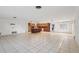 Spacious living area with an open kitchen and tile flooring, ready for customization at 8309 W Lake Marion Rd, Haines City, FL 33844