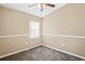 Well-lit bedroom with neutral walls and carpeting at 5119 Martinique Dr, Lakeland, FL 33812