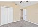 Spacious bedroom with double door closet and neutral decor at 5119 Martinique Dr, Lakeland, FL 33812