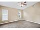 Spacious bedroom with neutral carpeting and ceiling fan at 5119 Martinique Dr, Lakeland, FL 33812