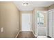 Bright entryway with tile flooring and closet at 5119 Martinique Dr, Lakeland, FL 33812