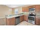 Kitchen with granite countertops and stainless steel appliances at 5119 Martinique Dr, Lakeland, FL 33812