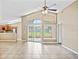 Spacious living room with vaulted ceiling and sliding glass doors at 5119 Martinique Dr, Lakeland, FL 33812