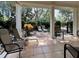 Relaxing covered patio with seating and lush landscaping at 622 Penn Pl, Winter Park, FL 32789