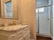 Bathroom boasts a vanity with marble top and shower at 622 Penn Pl, Winter Park, FL 32789