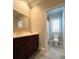 Elegant bathroom with double vanity and shower at 622 Penn Pl, Winter Park, FL 32789