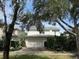 Charming two-story house with a gray roof and white exterior at 622 Penn Pl, Winter Park, FL 32789