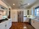 Modern kitchen with white cabinets, stainless steel appliances at 622 Penn Pl, Winter Park, FL 32789