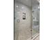 Spacious walk-in shower with marble tile and glass enclosure at 622 Penn Pl, Winter Park, FL 32789