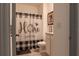 Bathroom with a decorative shower curtain, neutral tiling, and coordinated wall art at 637 Bernard Ln, Davenport, FL 33837