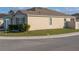 Exterior corner view of a single-story home with well-maintained lawn at 637 Bernard Ln, Davenport, FL 33837