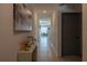 Bright hallway featuring tile floors, neutral walls, and an inviting view into the home at 637 Bernard Ln, Davenport, FL 33837