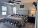 Comfortable bedroom with a plush bed, neutral decor, and ample natural light at 2503 Spring Breeze Dr, Leesburg, FL 34748