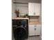 Laundry room with washer, dryer, and additional cabinets at 2503 Spring Breeze Dr, Leesburg, FL 34748