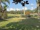 Backyard features landscaping and golf course views at 417 Lake Butler Dr, Kissimmee, FL 34759