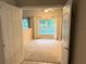 Bedroom with carpeting and a large window with natural lighting at 417 Lake Butler Dr, Kissimmee, FL 34759