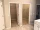 Hallway featuring two separate walk-in closets at 417 Lake Butler Dr, Kissimmee, FL 34759