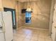 View of dining area features tile floors, bright lighting, and backyard view at 417 Lake Butler Dr, Kissimmee, FL 34759