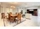 Dining area open to the living room features a chandelier and tile flooring at 417 Lake Butler Dr, Kissimmee, FL 34759