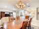 Open-concept living space features a dining room with chandelier lighting at 417 Lake Butler Dr, Kissimmee, FL 34759