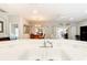 Open kitchen boasts a double sink overlooking the dining and living areas at 417 Lake Butler Dr, Kissimmee, FL 34759