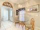 Bright kitchen nook featuring a glass table, wicker chairs, and natural light, ideal for a relaxed breakfast at 417 Lake Butler Dr, Kissimmee, FL 34759