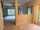 Carpeted living room with natural lighting, ceiling fan and neutral paint at 417 Lake Butler Dr, Kissimmee, FL 34759