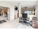 Bright living room featuring neutral tones, sleek entertainment center, and an inviting open floor plan at 417 Lake Butler Dr, Kissimmee, FL 34759