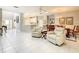 Open-concept living room with lots of light adjacent to the dining room at 417 Lake Butler Dr, Kissimmee, FL 34759
