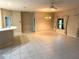 Open concept living space with tiled floors, access to other living spaces and neutral walls at 417 Lake Butler Dr, Kissimmee, FL 34759