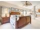 Spacious main bedroom featuring a decorative ceiling fan and a relaxing, neutral color palette at 417 Lake Butler Dr, Kissimmee, FL 34759