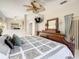 Comfortable main bedroom with decorative ceiling fan, carved wooden furniture, and relaxing, neutral color palette at 417 Lake Butler Dr, Kissimmee, FL 34759
