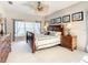 Relaxing main bedroom featuring plenty of natural light, and stylish decorative ceiling fan at 417 Lake Butler Dr, Kissimmee, FL 34759