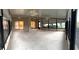 Large sunroom featuring wall-to-wall windows and multiple ceiling fans at 417 Lake Butler Dr, Kissimmee, FL 34759