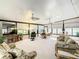 Bright sunroom featuring wall-to-wall windows and comfortable seating at 417 Lake Butler Dr, Kissimmee, FL 34759