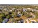 Aerial view of a quiet residential neighborhood with mature trees surrounding the homes at 11213 Se 53Rd Ct, Belleview, FL 34420