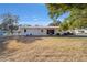 Expansive backyard view with red roofed house at 11213 Se 53Rd Ct, Belleview, FL 34420