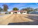 Exterior view of home with mature trees and spacious front yard at 11213 Se 53Rd Ct, Belleview, FL 34420