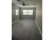 Spacious bedroom with gray flooring and ceiling fan at 1703 Mona Ave, Ocoee, FL 34761