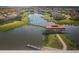 Aerial view of community with lake and clubhouse at 1851 Goblet Cove St, Kissimmee, FL 34746