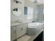 Spa-like bathroom with soaking tub and double vanity at 1851 Goblet Cove St, Kissimmee, FL 34746