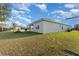 The property features a backyard with a small tree, a grill, and a picnic table at 812 Brooklet Dr, Davenport, FL 33837