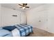 This bedroom has neutral carpeting and is equipped with a ceiling fan and closet at 812 Brooklet Dr, Davenport, FL 33837