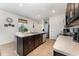 An island kitchen featuring stainless steel appliances, wood cabinets, and tile floors at 812 Brooklet Dr, Davenport, FL 33837